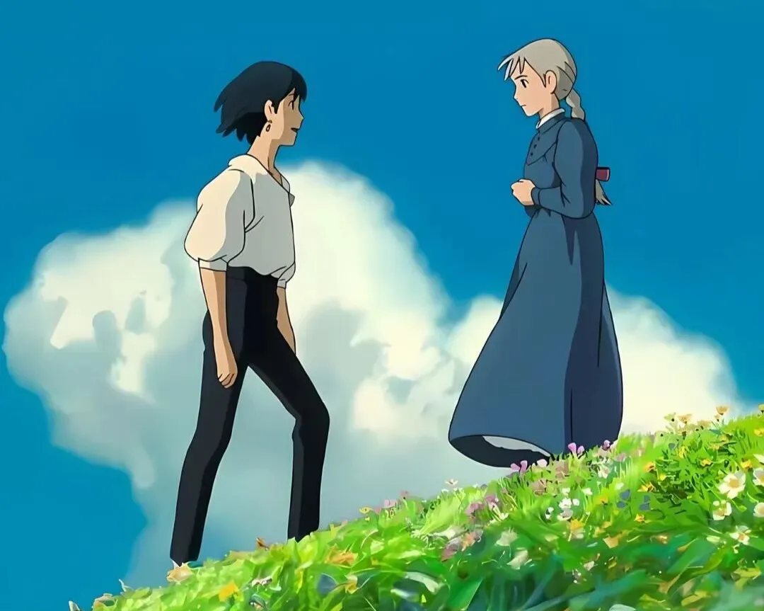 In the movie 'Howl's Moving Castle,' Sophie and Howl are gazing at each other, standing on a green grass hilltop blown by the wind.